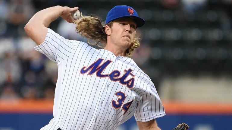 Mets starting pitcher Noah Syndergaard(Thor) throws the first pitch