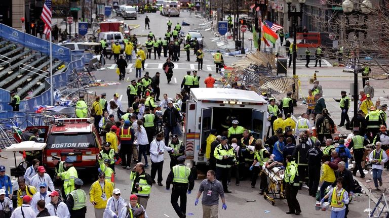 Medical workers aid injured people following an explosion at the...