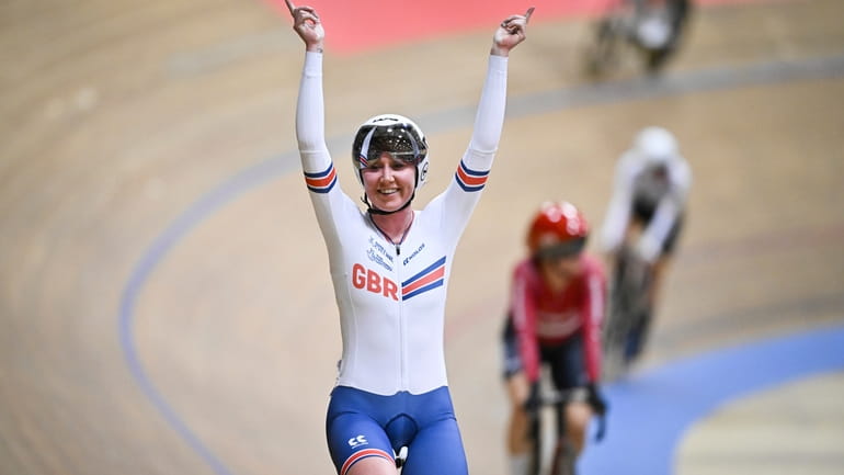 Katie Archibald of Great Britain reacts after winning the women's...