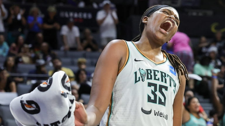 Jonquel Jones #35 of the New York Liberty reacts after...