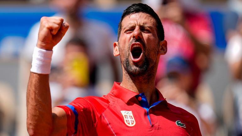 Serbia's Novak Djokovic celebrates his victory over Germany's Dominik Koepfer...