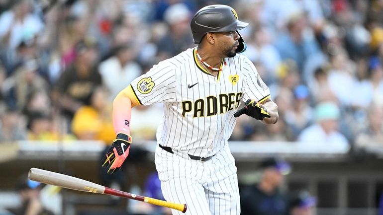 San Diego Padres' Xander Bogaerts hits an RBI single during...