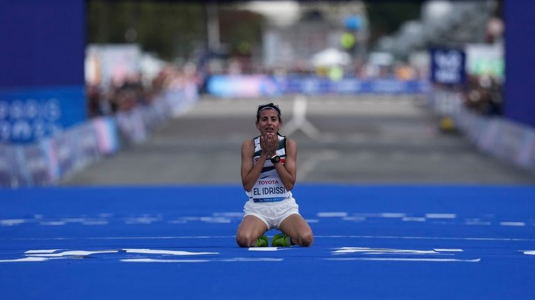 Morocco's Fatima Ezzahra El Idrissi celebrates as she wins the...