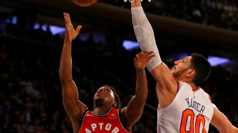 Enes Kanter blocks a shot by Raptors' Kyle Lowry in...