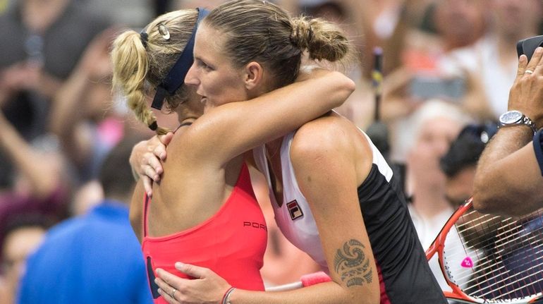 Angelique Kerber reacts after defeating Karolina Pliskova in three sets...