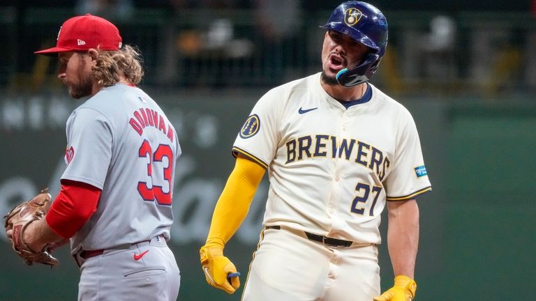 Milwaukee Brewers' Willy Adames reacts after hitting an RBI double...