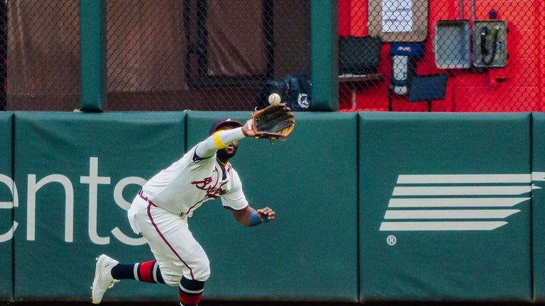 Atlanta Braves outfielder Michael Harris II catches a pop fly...