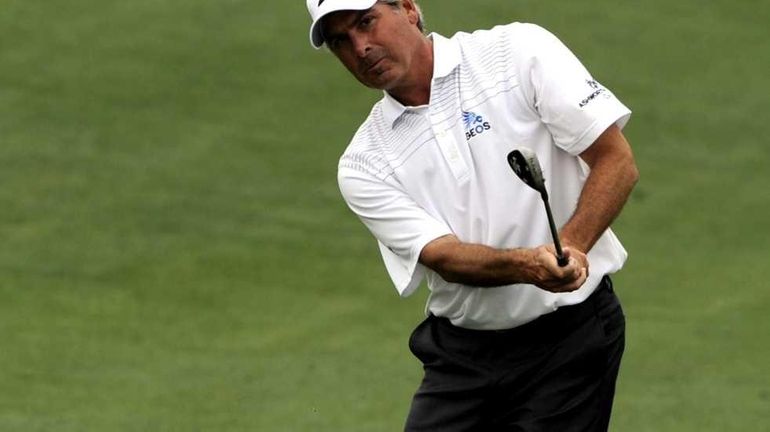 Fred Couples hits a shot on the second hole during...