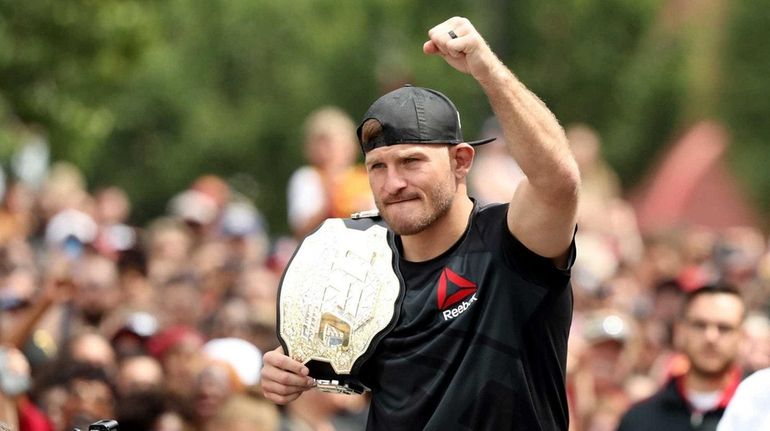 UFC heavyweight champion Stipe Miocic looks on during the Cleveland...