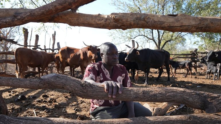 Tembanechako Mastick, a former poacher who now teaches conservation, poses...