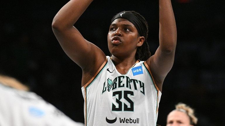 Liberty forward Jonquel Jones shoots a free throw against the...