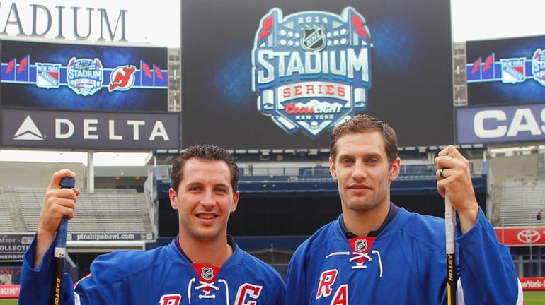 Rangers players Ryan Callahan, left, and Dan Girardi pose for...