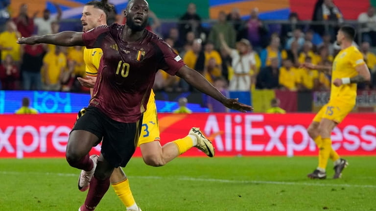 Belgium's Romelu Lukaku celebrates during a Group E match between...