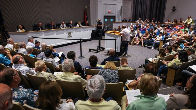 Residents debate allowing basements and garages as accessory dwelling units during...