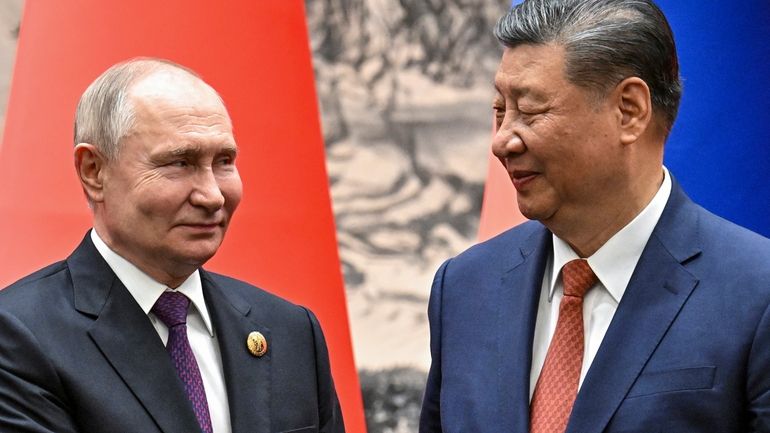 Chinese President Xi Jinping, right, and Russian President Vladimir Putin...