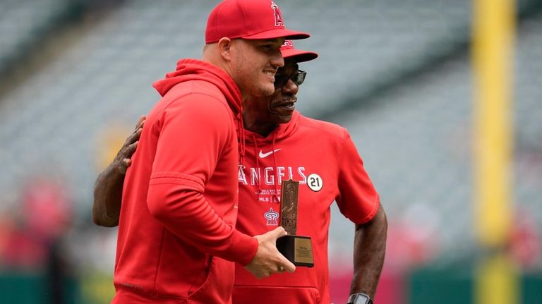 Los Angeles Angels' Mike Trout, left, is recognized as the...