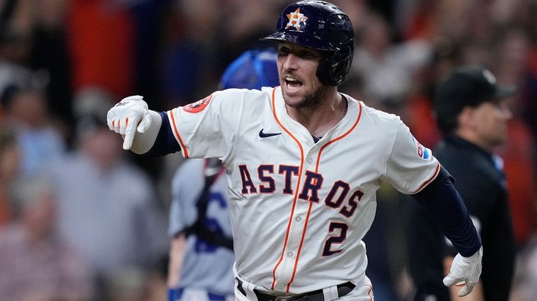 Houston Astros' Alex Bregman celebrates after hitting a walk-off home...