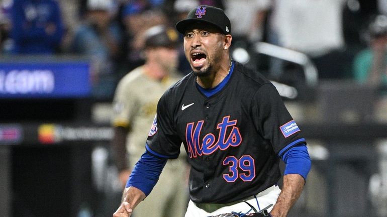 Mets pitcher Edwin Diaz reacts after striking out San Diego...