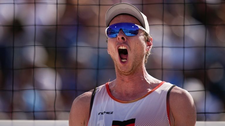 Germany's Nils Ehlers celebrates during the men's quarterfinal beach volleyball...