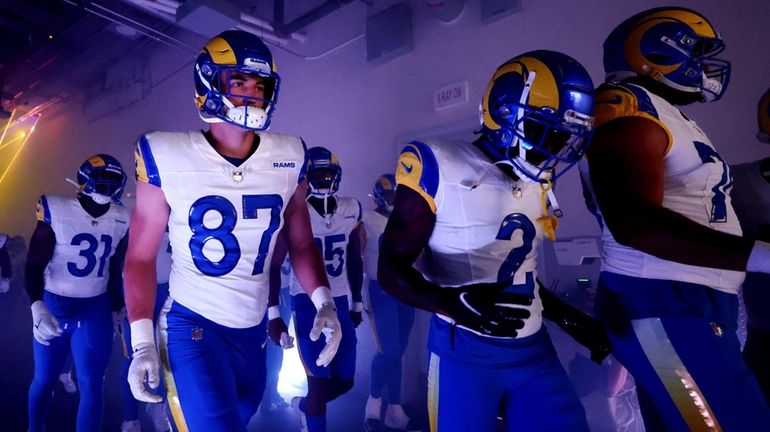 The Los Angeles Rams walk the player tunnel before the...