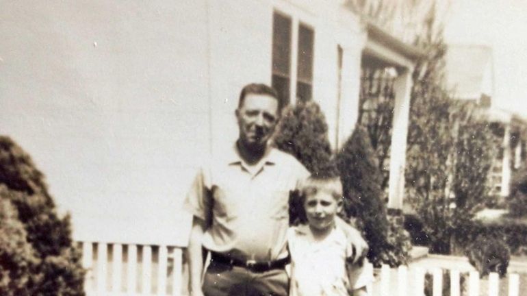 Allen McGovern with his father, Francis, in the yard of...