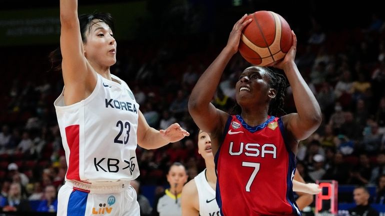 United States' Ariel Atkins shoots at goal as South Korea's...