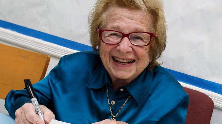 Dr. Ruth Westheimer signs a copy of her book "Sexually...