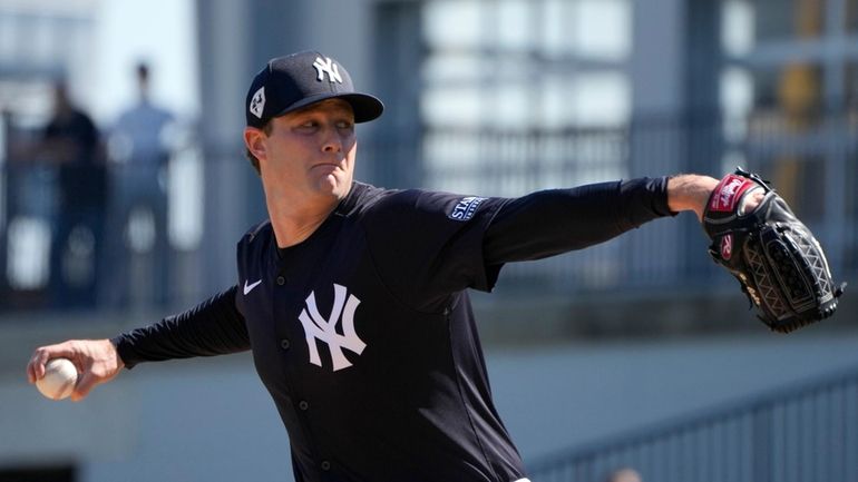 New York Yankees starting pitcher Gerrit Cole throws during a...