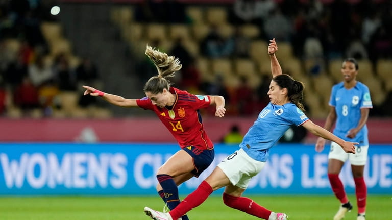 France's Amel Majri fouls Spain's Laia Aleixandri, left, during the...