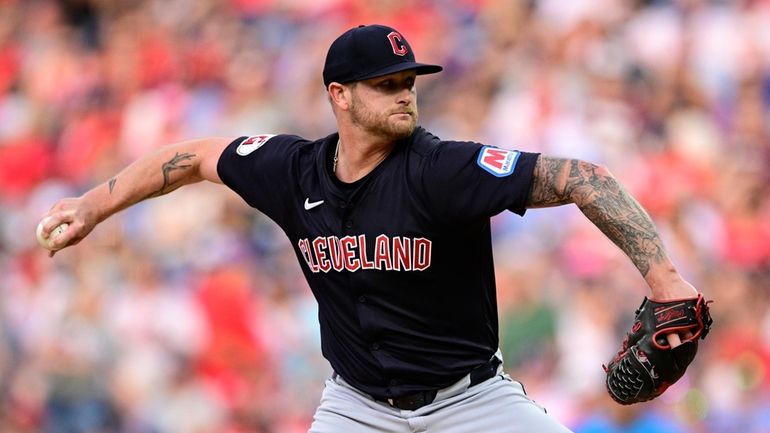 Cleveland Guardians' Ben Lively throws during the first inning of...