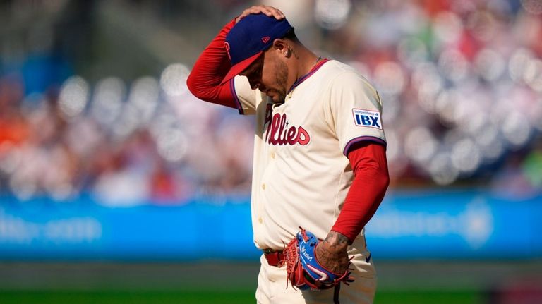 Philadelphia Phillies pitcher Taijuan Walker adjusts his hat during the...