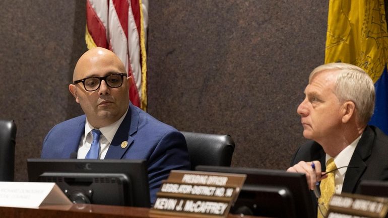 Special Counsel Richard Donoghue, right, and Suffolk County Legis. Anthony...