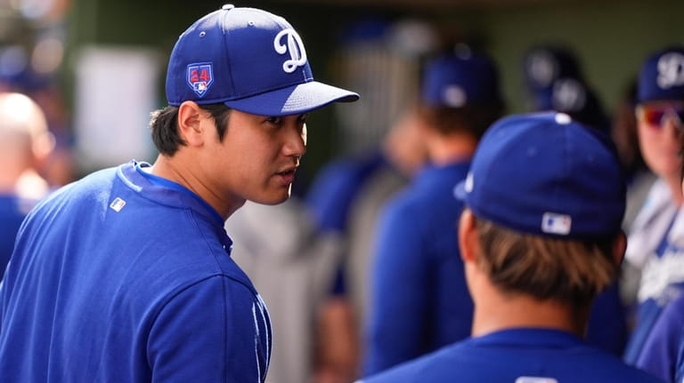 Los Angeles Dodgers designated hitter Shohei Ohtani, left, and starting...