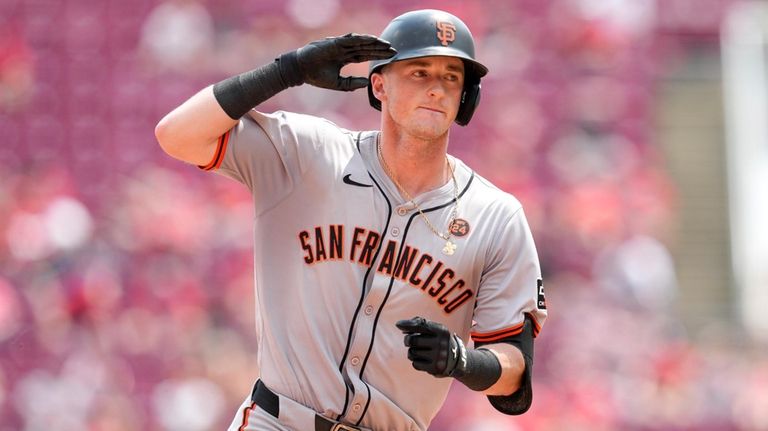 San Francisco Giants' Tyler Fitzgerald rounds the bases after hitting...