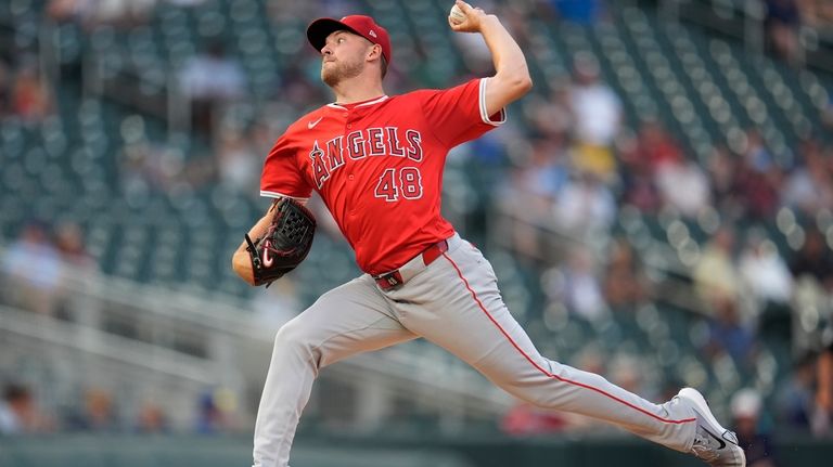 Los Angeles Angels starting pitcher Reid Detmers delivers during the...