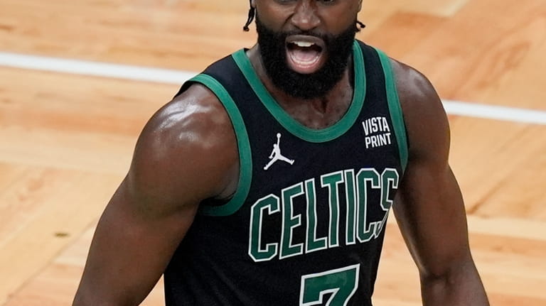 Boston Celtics guard Jaylen Brown (7) reacts after scoring during...