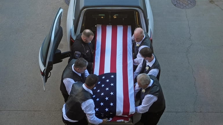 The casket of Santaquin Police Sgt. Bill Hooser arrives at...