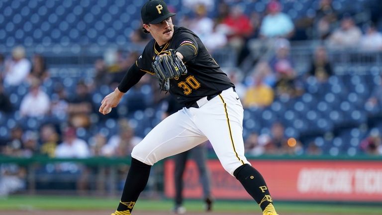 Pittsburgh Pirates starting pitcher Paul Skenes delivers during the first...