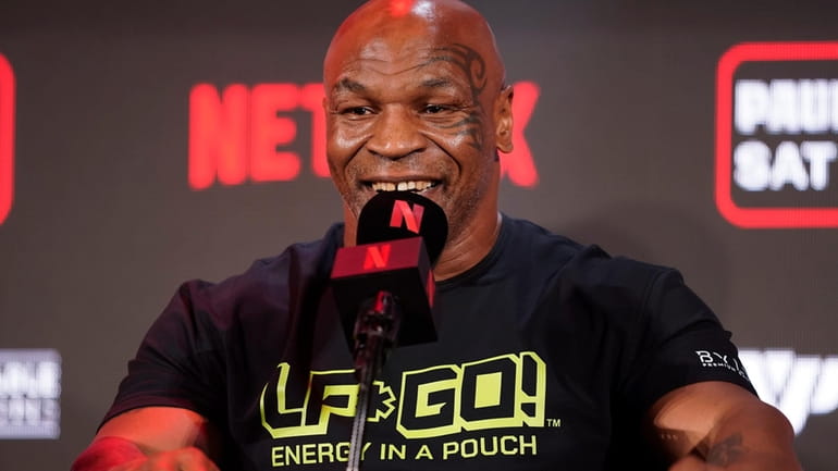 Mike Tyson speaks during a news conference about his upcoming...