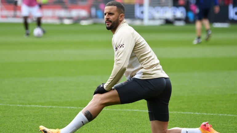 Manchester City's Kyle Walker warms up prior to the English...
