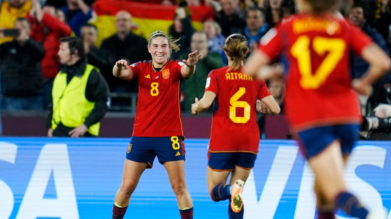 Spain's Mariona Caldentey, left, celebrates after teammate Olga Carmona scored...