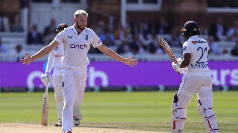 England's Gus Atkinson celebrates after dismissing Sri Lanka's Kamindu Mendis...