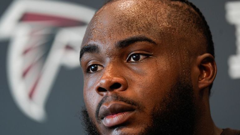 Atlanta Falcons defensive end Grady Jarrett speaks to the media...