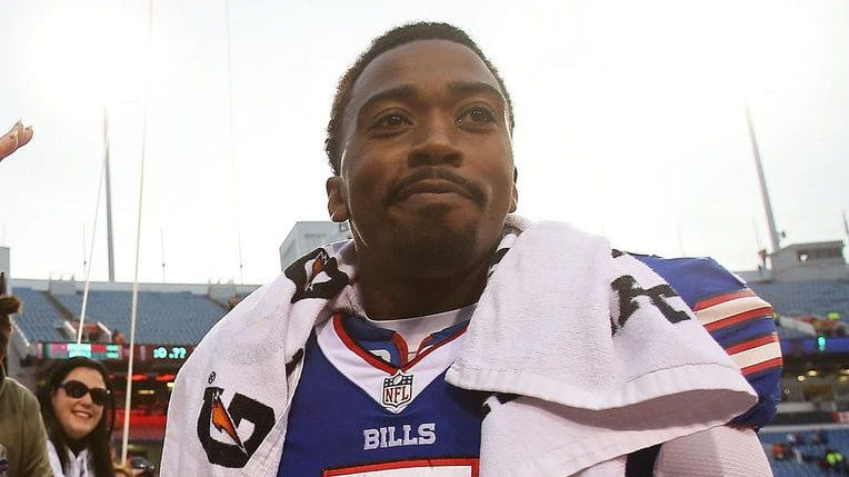 Tyrod Taylor #5 of the Buffalo Bills celebrates with fans...