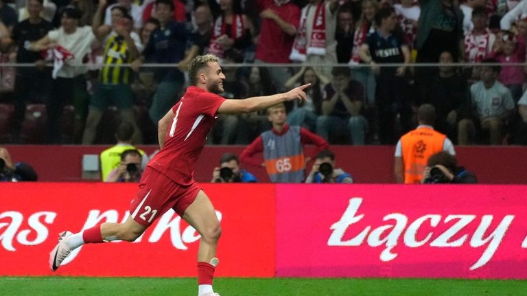 Turkey's Baris Alper Yilmaz celebrates after scoring his side's opening...