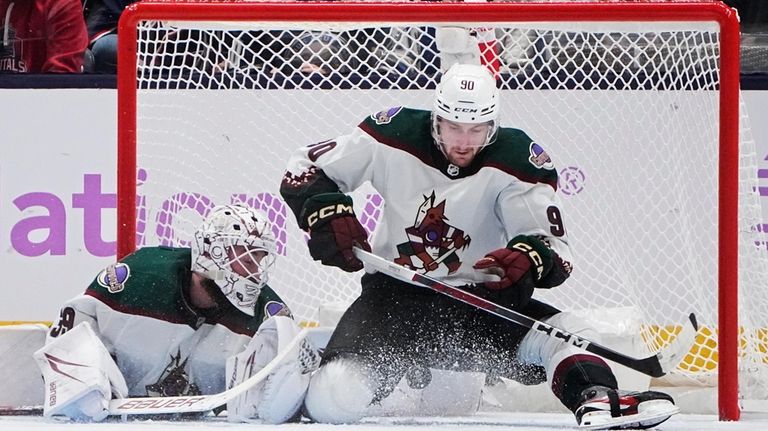 Arizona Coyotes defenseman J.J. Moser (90) blocks a shot next...