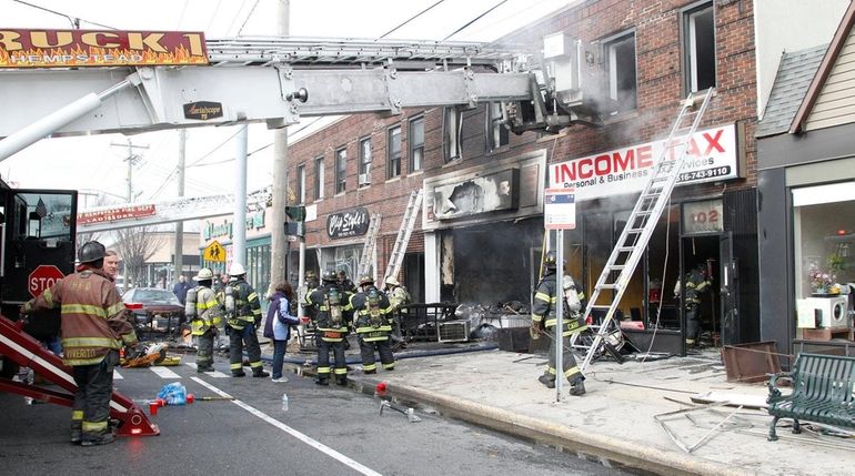 Firefighters at a fire in West Hempstead on Hempstead Turnpike...