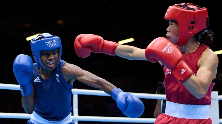 Britain's Nicola Adams, left, and India's Chungneijang Mery Kom Hmangte...