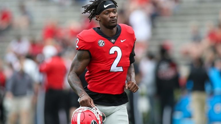 Georgia linebacker Smael Mondon Jr. (2) runs off the field...