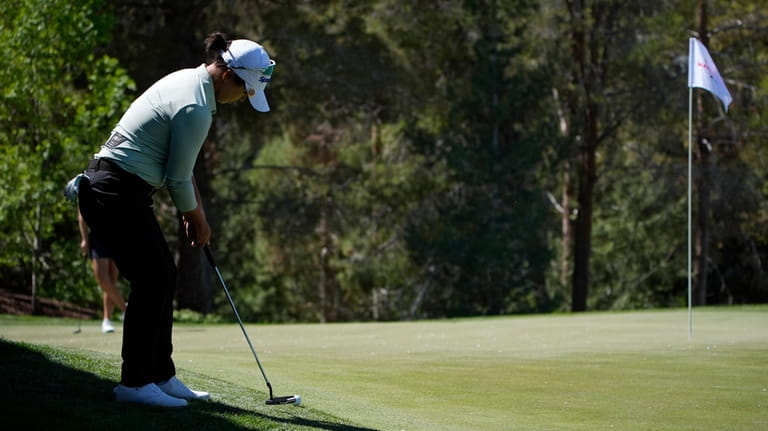 Sei Young Kim putts onto the 13th green during the...